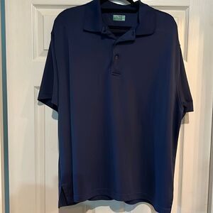 Navy blue men’s two XL Ben Hogan performance golf shirt. Like new.